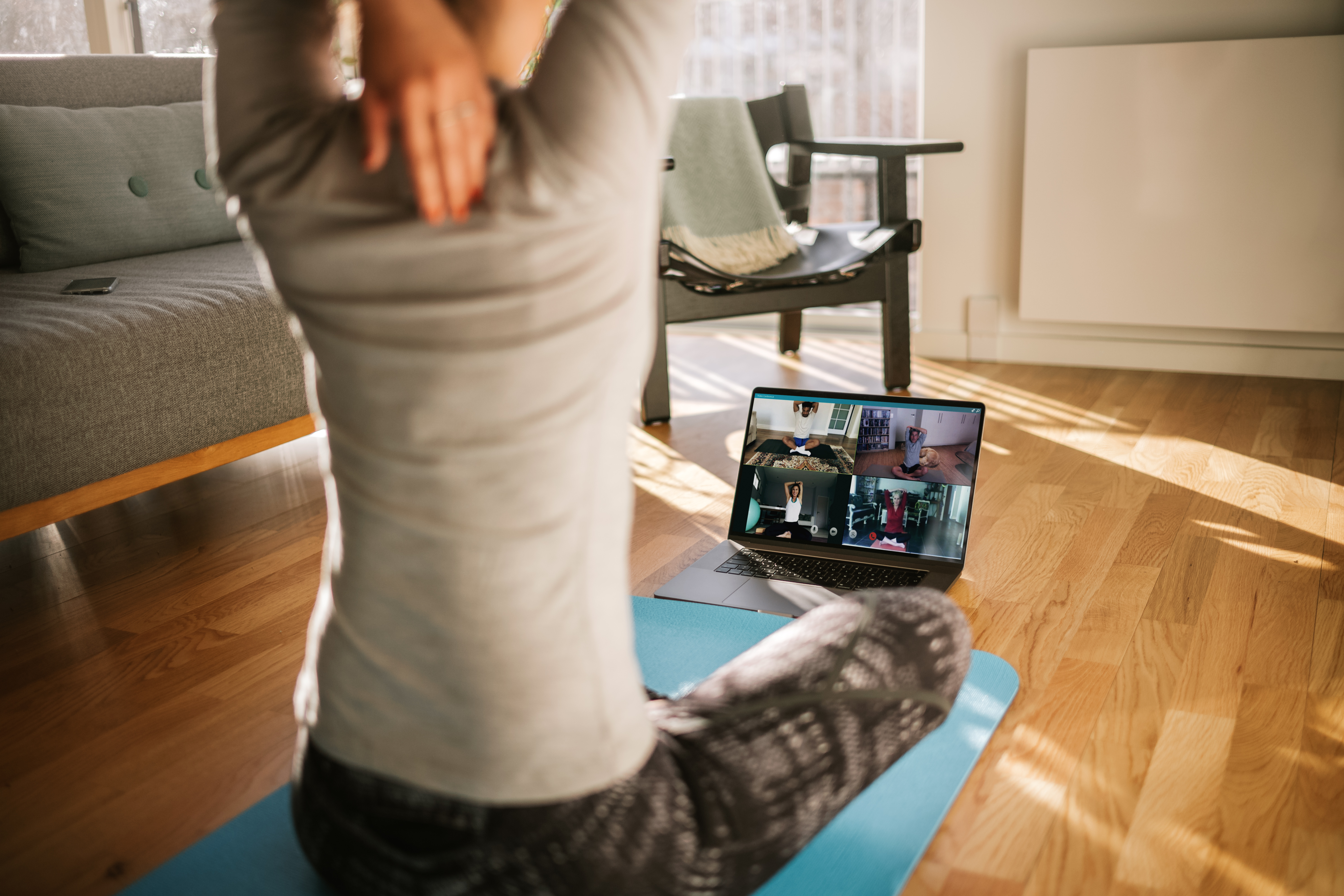 4 ways to bring ‘touch’ to your online yoga classes